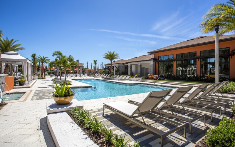 resort style pool with seating in a courtyard